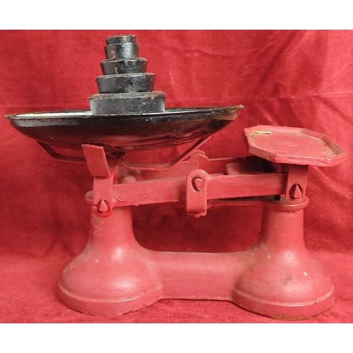 154 - A set of vintage kitchen scales with weights.