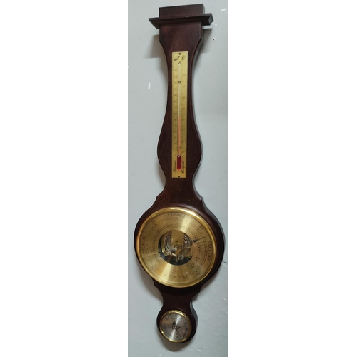 165 - A wood cased barometer. Measuring 65cm tall.