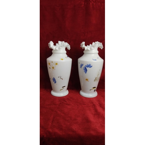 191 - A pair of antique hand painted milk glass vases with uranium glaze, each measuring approx 18 cm tall... 