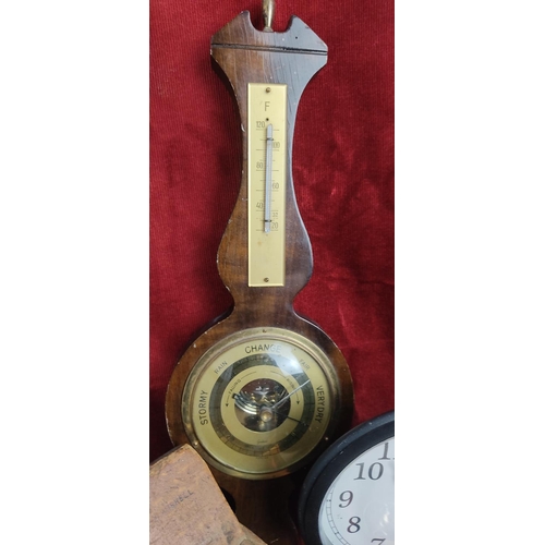 197 - An assortment of various items to include wood cased barometer, bicycle clock & more.