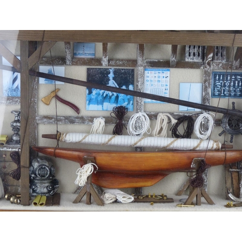 210 - A framed nautical/ yacht display. Measuring 53cm x 35cm.