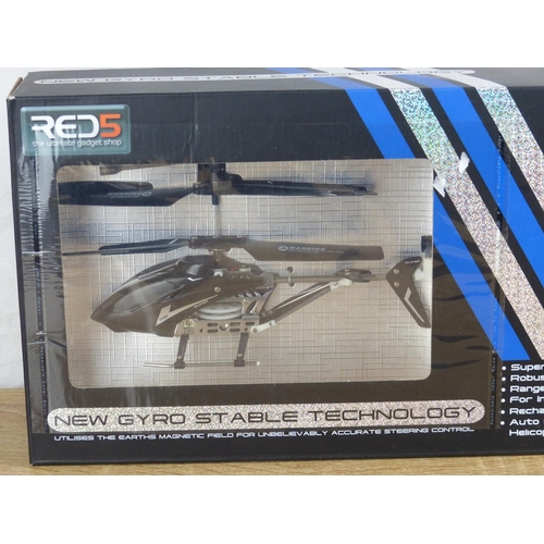 219 - A boxed Red 5 U4 metal series remote control helicopter.