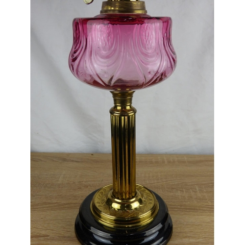 229 - A stunning antique/ Victorian oil lamp with brass base, decorative Ruby glass font & etched Ruby gla... 