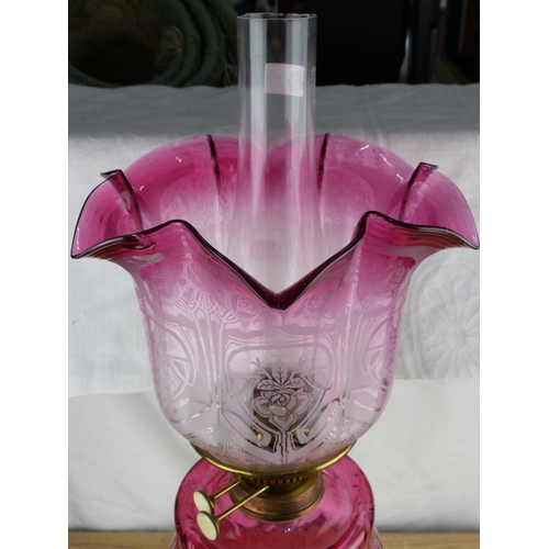 229 - A stunning antique/ Victorian oil lamp with brass base, decorative Ruby glass font & etched Ruby gla... 