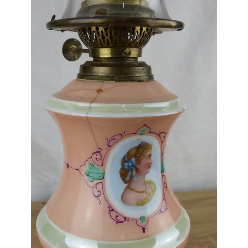 230 - A stunning antique oil lamp with ceramic base (a/f) and hand painted portraits, along with decorativ... 