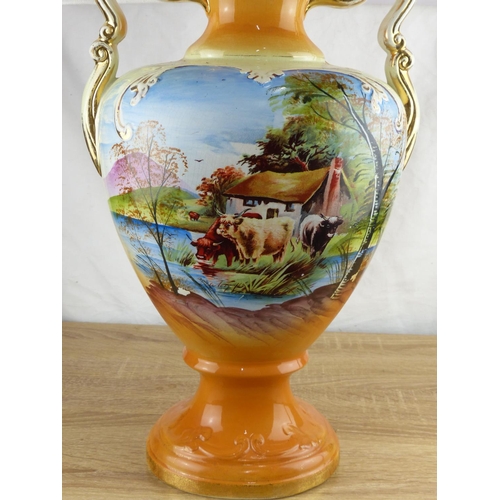 237 - A large decorative antique hand painted vase/ urn, measuring aprrox 52cm tall.