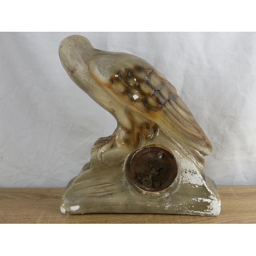 248 - A vintage ceramic cased clock, modelled as an eagle.