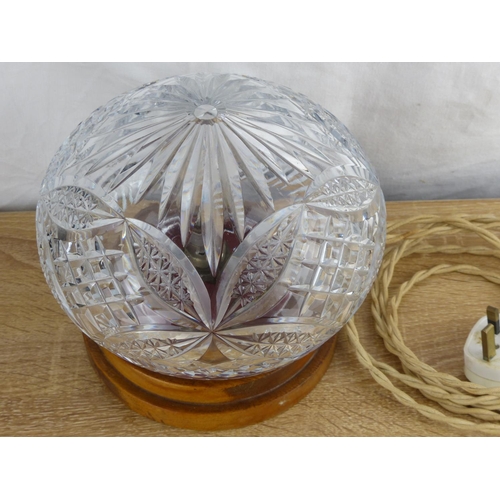 265 - A vintage cut glass/ crystal table lamp with wooden base.