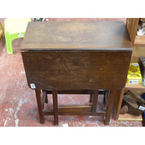 267 - An antique oak gateleg table.