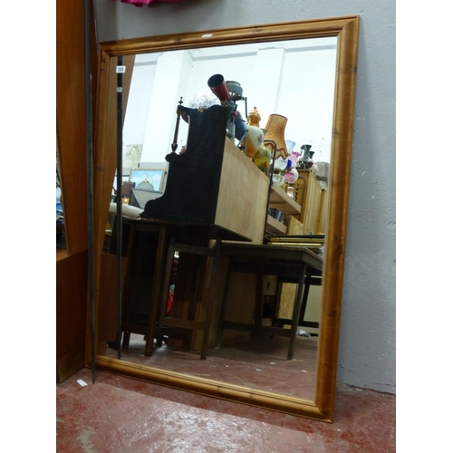 268 - A large pine framed mirror, measuring approx 133cm x 103cm.