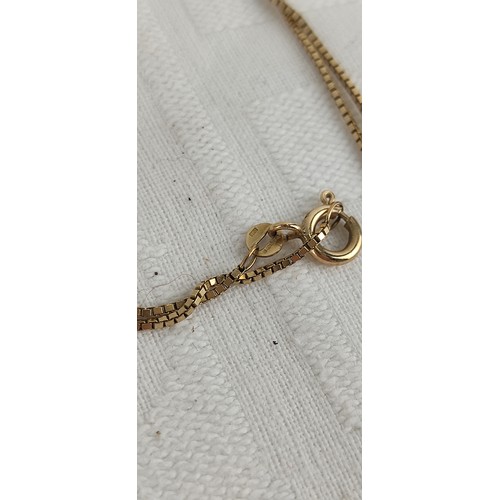 73 - A 9ct gold pendant with chain, weighing 3.65 grams.