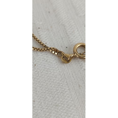 73 - A 9ct gold pendant with chain, weighing 3.65 grams.