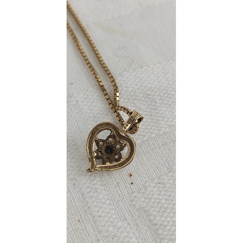 73 - A 9ct gold pendant with chain, weighing 3.65 grams.