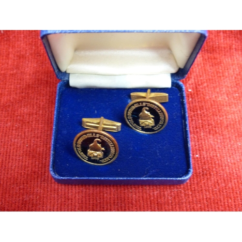 419 - A pair of cased 'Old Bushmills Distillery Co Ltd' cufflinks.