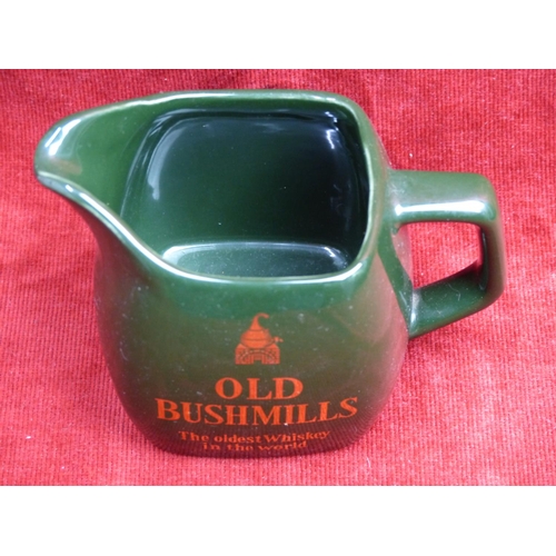 422 - A vintage Wade 'Old Bushmills - The Oldest Whiskey in the World' pub jug.