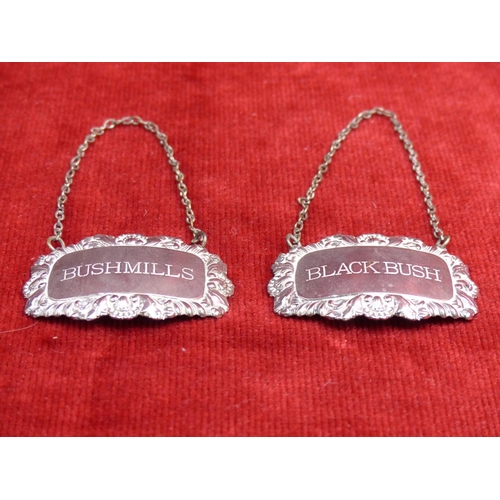 424 - Two vintage silver plated whiskey decanter labels 'Bushmills' and 'Black Bush'.