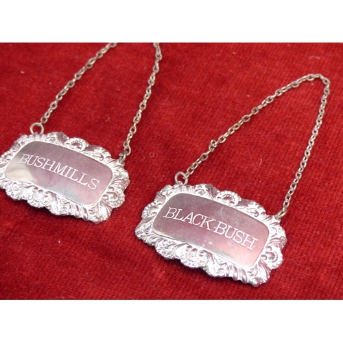 424 - Two vintage silver plated whiskey decanter labels 'Bushmills' and 'Black Bush'.