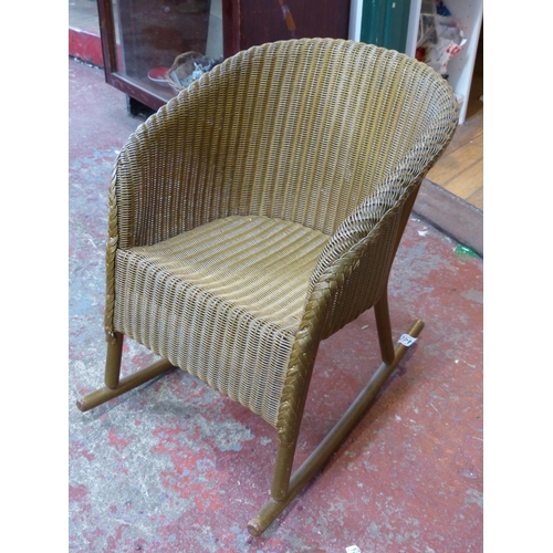 440 - An unusual vintage Lloyd loom child's rocking chair.