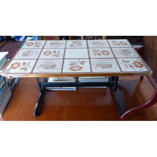 442 - A vintage tiled topped coffee table on a metal frame.