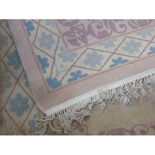 445 - A pink patterned floor rug.