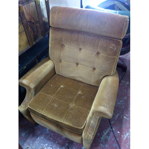 450 - A vintage Parker Knoll reclining armchair with gold velvet upholstery.