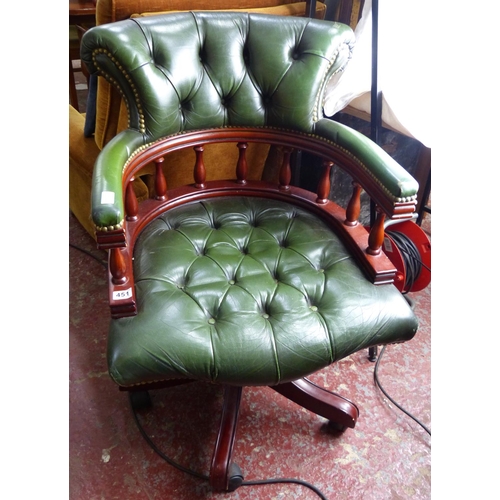 451 - A stunning leather upholstered captains style desk chair with swivel base.