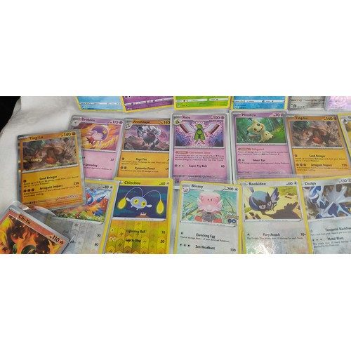 202 - A collection of rare holo / reverse holo Pokemon cards all in protective sleeves.