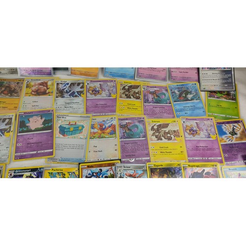 202 - A collection of rare holo / reverse holo Pokemon cards all in protective sleeves.