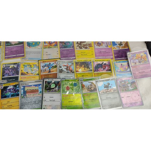 202 - A collection of rare holo / reverse holo Pokemon cards all in protective sleeves.