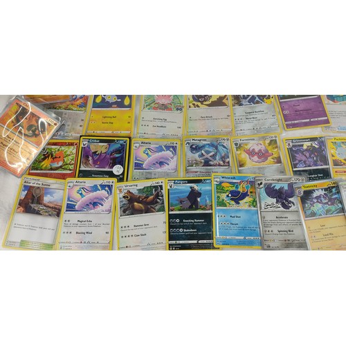 202 - A collection of rare holo / reverse holo Pokemon cards all in protective sleeves.