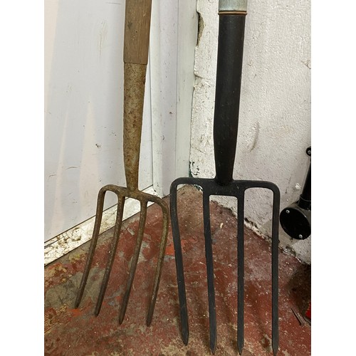 433 - Two vintage garden forks.