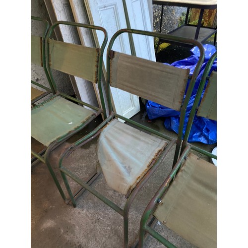 435 - Five vintage metal framed stacking chairs with fabric seats