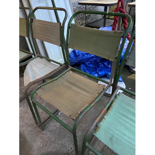 435 - Five vintage metal framed stacking chairs with fabric seats