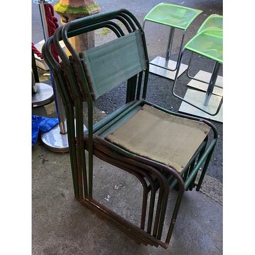 435 - Five vintage metal framed stacking chairs with fabric seats