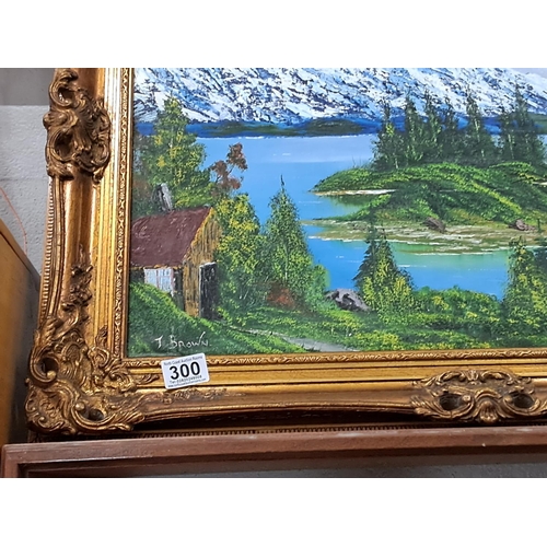 300 - A painting of a lake scene in stunning French Rococo style frame, signed T.Brown. Measuring approx 7... 