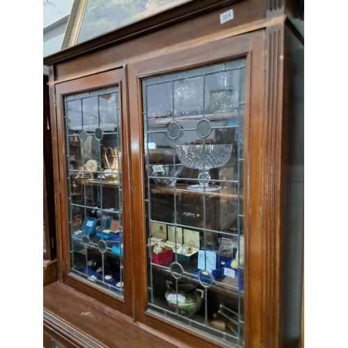 304 - An antique/ Edwardian library bookcase with stained glass and art nouveau copper fittings. (in need ... 