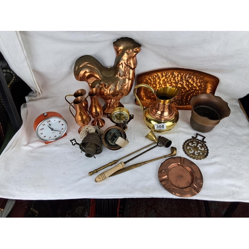 308 - An assortment of vintage items to include copperware, clocks and more.