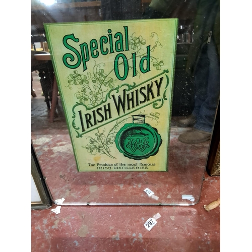 319 - A vintage mirror with Special old Irish Whisky. Measuring approx 69cm  x 48cm