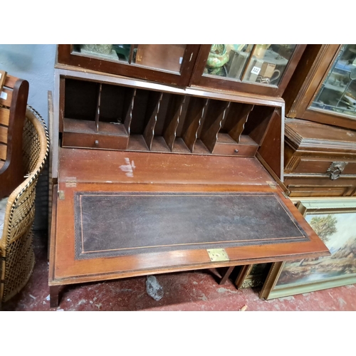 321 - An antique library bookcase / bureau. (In need of restoration).