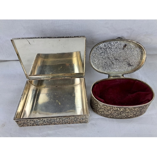 325 - Two vintage white metal trinket boxes.