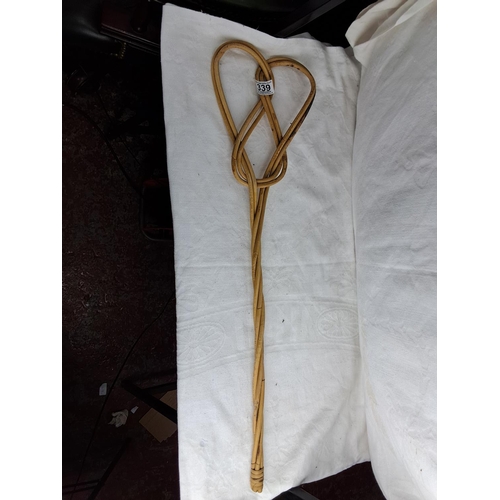 339 - A vintage rug beater.