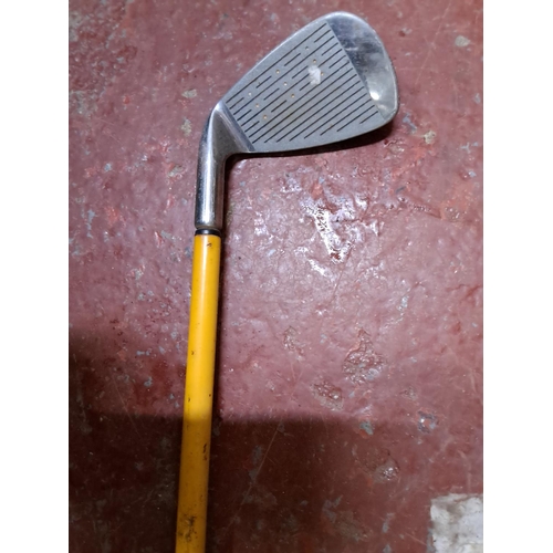 340 - A vintage Momentus Golf swing trainer.