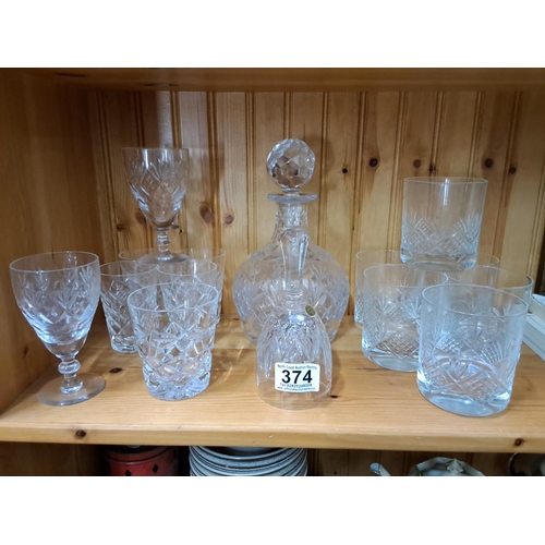 374 - A stunning vintage crystal decanter and an assortment of cut glass glasses.