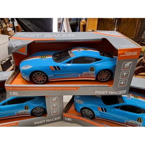 376 - Three boxed Fast Racer cars.