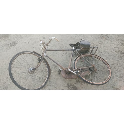 461 - A vintage bicycle with original bike lamp, bell, brooks seat and more.