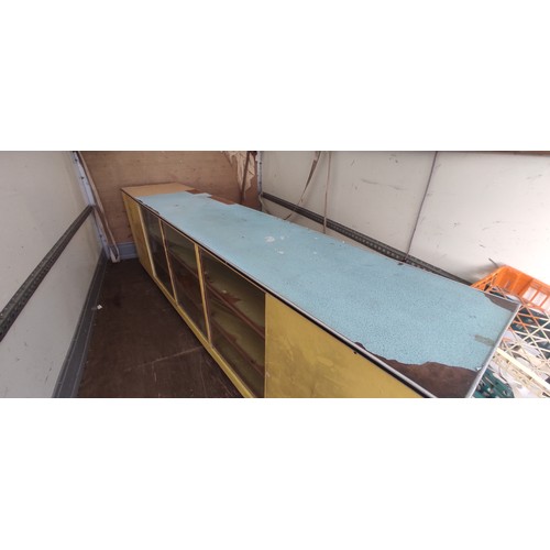 278 - A large vintage shop counter, measuring 305cm x 85cm x 61cm.