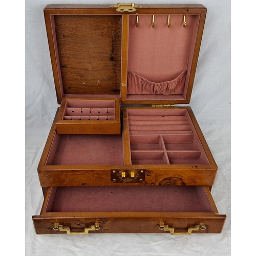 13 - An antique style jewellery box with decorative brass fittings.