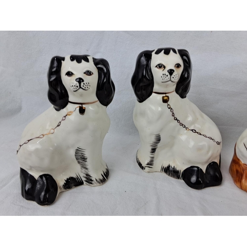 21 - Four antique / vintage Staffordshire mantle dogs, measuring approx 12cm each.