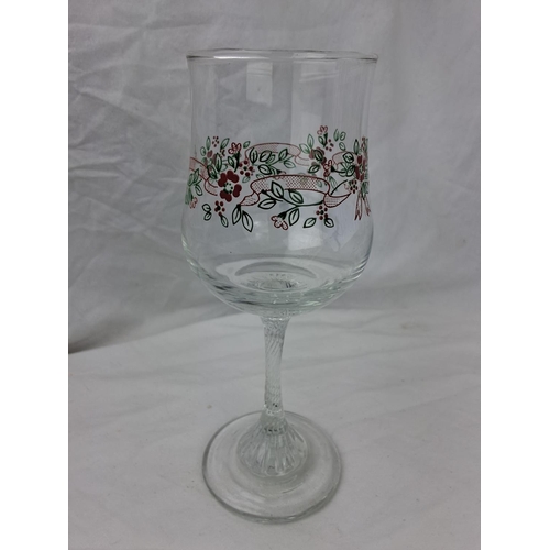 22 - A large collection of vintage wine glasses with decorative stems.