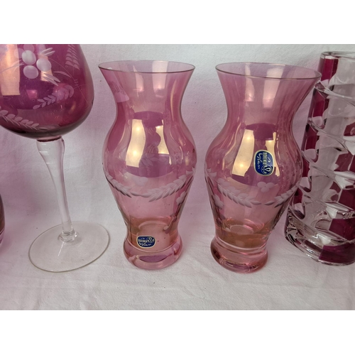 24 - A large collection of vintage ruby and cranberry glassware.